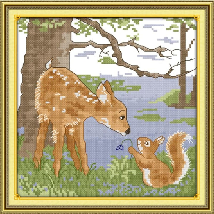 A deerlet and a squirrel in the forest