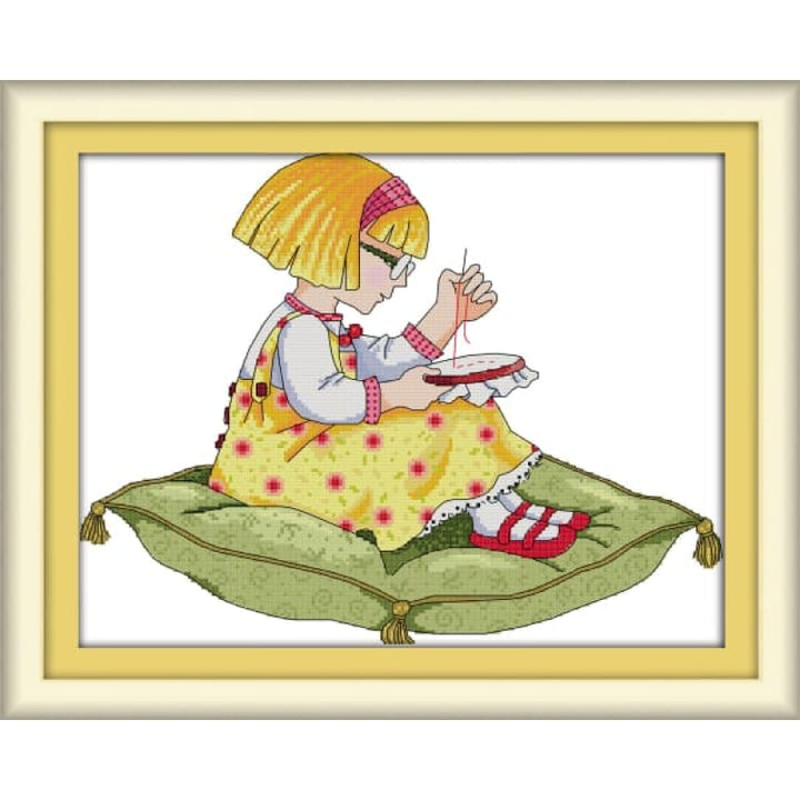 A girl with embroidered cross stitch